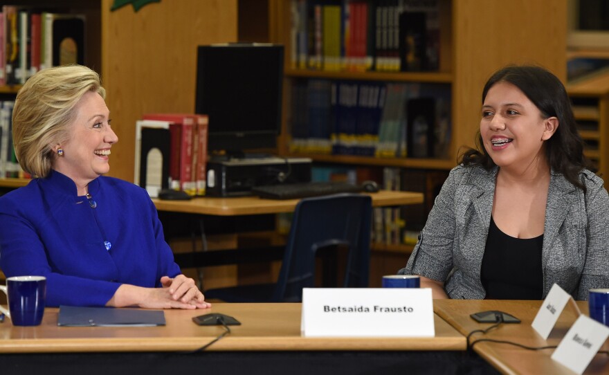 Democratic presidential candidate and former U.S. Secretary of State Hillary Clinton speaks with student Betsaida Frausto on May 5 at Rancho High School in Las Vegas. Clinton said that any immigration reform would need to include a path to "full and equal citizenship."