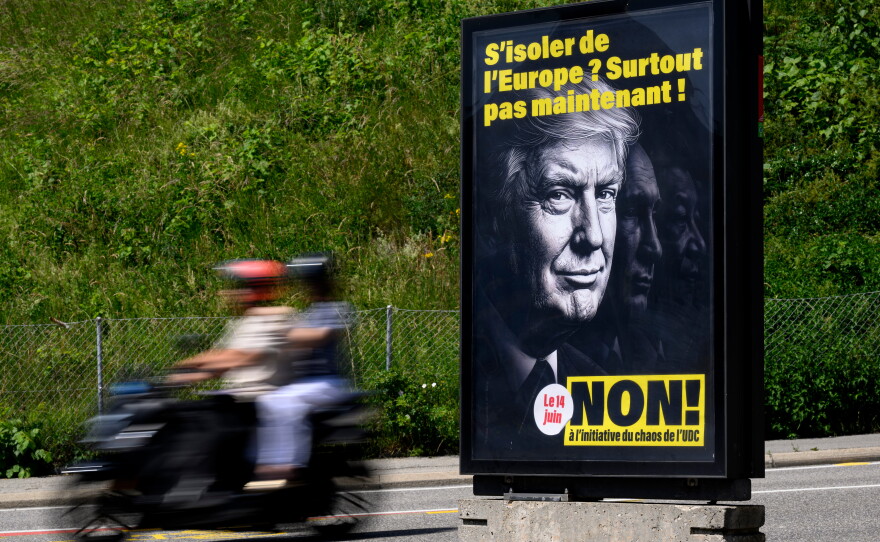A poster reading "Isolate ourselves from Europe? Certainly not now! - No to the SVP/UDC Chaos initiative" featuring images of President Donald Trump, Russian President Vladimir Putin and Chinese President Xi Jinping, urging people to vote against the Swiss People's Party (SVP) referendum titled "No to a Switzerland with 10 million inhabitants" photographed in Lausanne, May 27, 2026.
