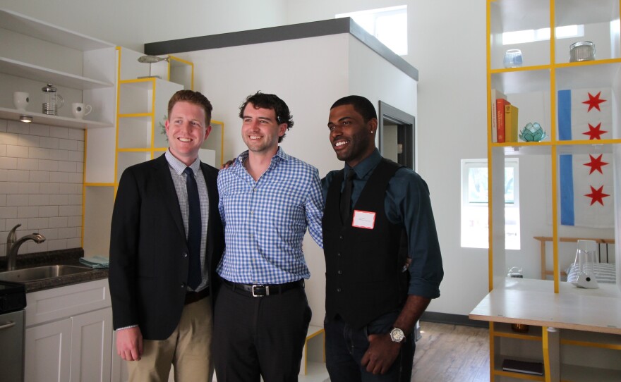 Lon Stausland (left,) Marty Sandberg and Terry Howell are the winners of the American Institute of Architects tiny homes competition. They posed inside the prototype of their design.