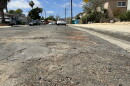 A close up view of a road in the College East neighborhood of San Diego that has been identified in the city's Pavement Management Plan as in need of repair.