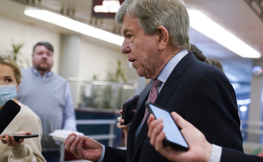 Sen. Roy Blunt, R-Mo., is surrounded by reporters as he walks on Capitol Hill, Tuesday, May 10, 2022.
