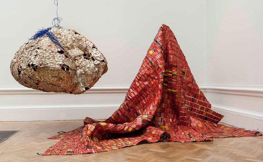 El Anatsui's work of reclaimed, found objects, "AG + BA (AR)," is shown here in its original form. Anatsui re-envisioned the work for augmented reality, on view beginning Sept. 1, 2021 at the San Diego Botanic Garden.