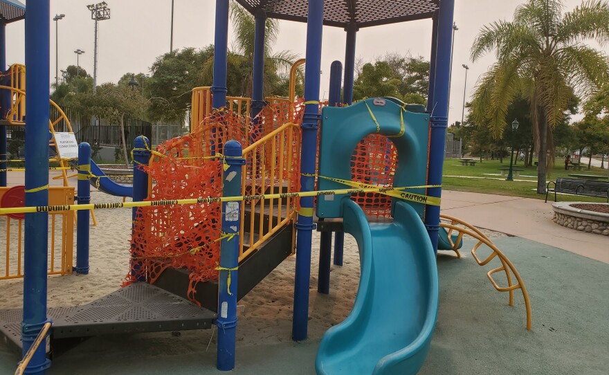 A City Heights playground wrapped in orange fence and caution tape, Sept. 8, 2020.