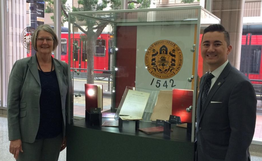 San Diego City Council President Sherri Lightner and Councilman Chris Cate pose with the city's charter in the Civic Center lobby, April 7, 2015.