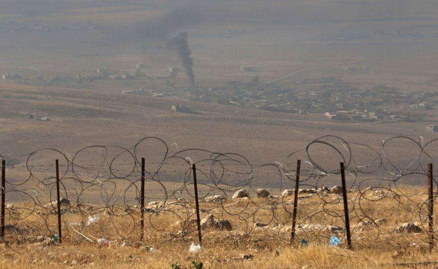 A picture taken from the top of Mount Zardak, about 25 kilometers east of Mosul, shows smoke billowing in the Iraqi city of Nineveh during an operation against the Islamic State on Monday — part of a broad operation to retake the city from the Islamic State group.