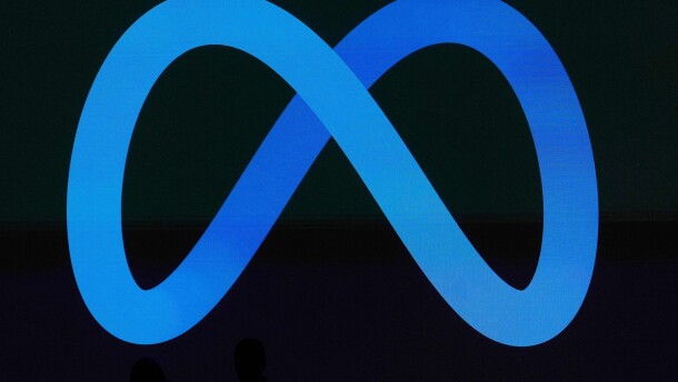 FILE - A Meta logo is shown on a video screen at LlamaCon 2025, an AI developer conference, in Menlo Park, Calif., April 29, 2025.