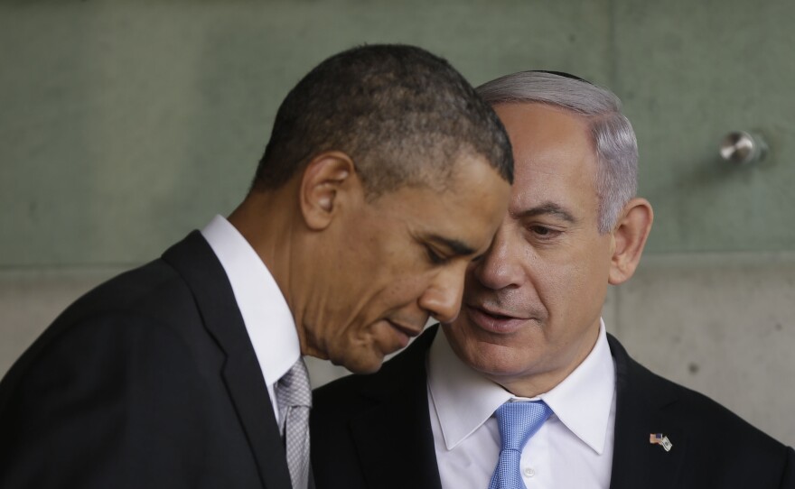 President Obama listens to Israeli Prime Minister Benjamin Netanyahu during their March 22, 2013, visit to a Holocaust memorial in Jerusalem.
