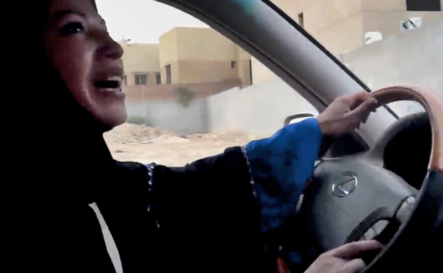 A Saudi woman drives a car in Riyadh in June as part of a campaign to defy the kingdom's ban on women driving. The image is from a video released by Change.org.