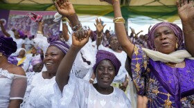 Women chants slogans during the International Women's Day celebration at the Mobolaji Johnson Stadium in Lagos , Nigeria, Wednesday , March. 8, 2023.