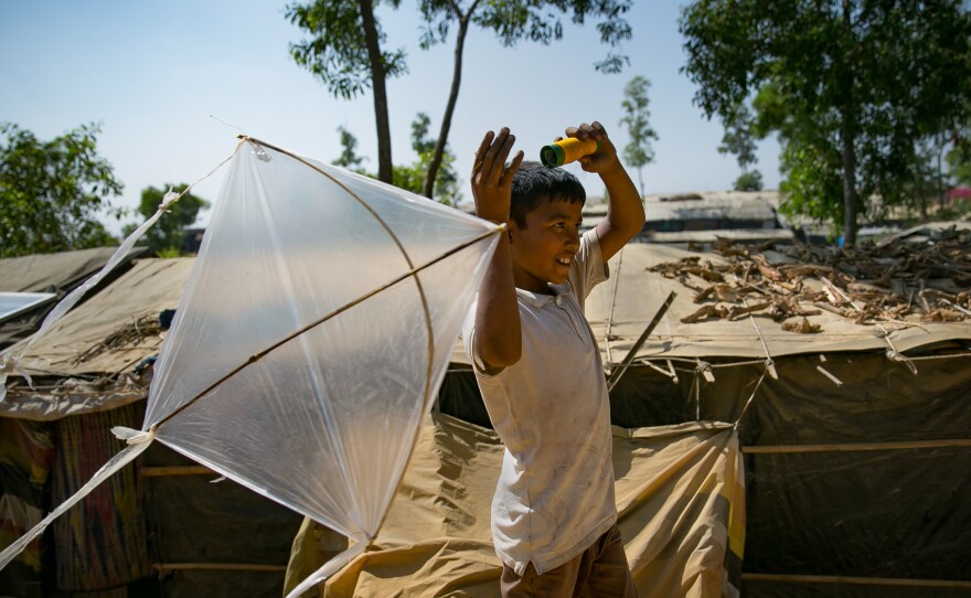 Fayes Khamal tests out a kite he's just made in the Hakimpara Rohingya refugee camp in Bangladesh.