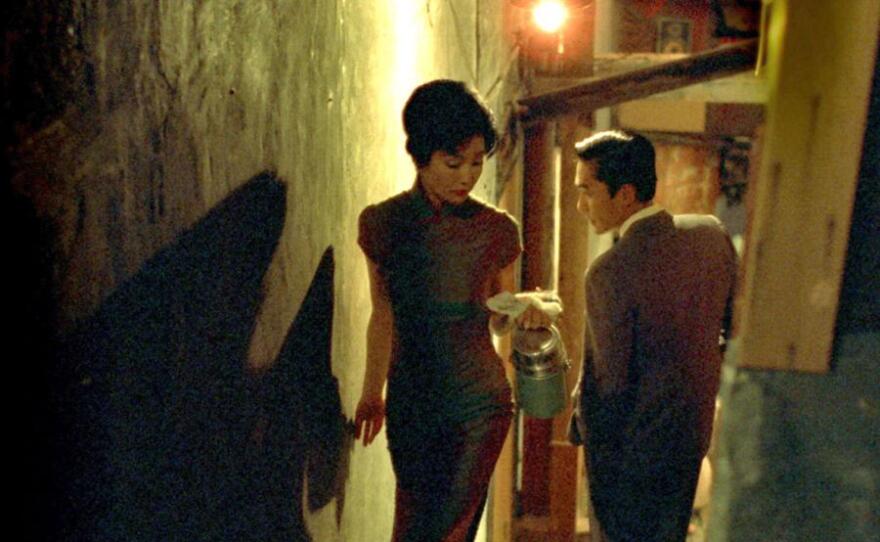 Maggie Cheung and Tony Leung passing each other on the stairs in Wong Kar-wai's "In the Mood for Love." (2