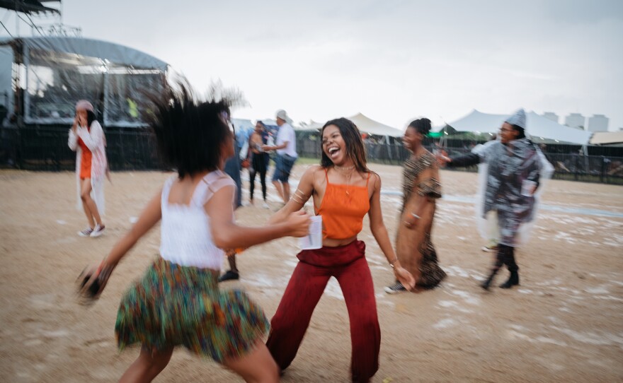 Rain can't dampen the spirits of Afropunk Joburg attendees. They continue to dance as rain begins to fall in Johannesburg in December 2017.