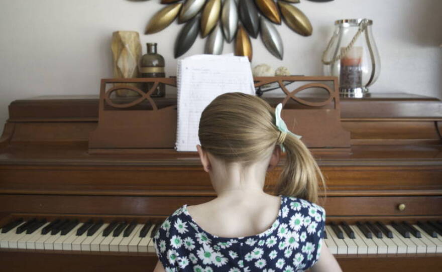 Nevaeh Emery, 8, plays the piano in the family room of her Carson City home in this undated photo. 