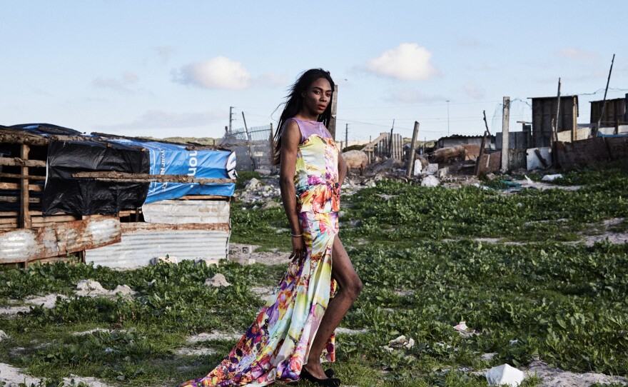 Shakira Mabika, 24, emigrated to South Africa from Zimbabwe, where the former president "has referred to people like me as 'pigs' and un-African." She asked to be photographed by dilapidated shacks where pigs were kept behind a fence. "I moved to Cape Town in search for a space where I could live my truth," she says. But she says she has faced transphobia and still hasn't found a job.