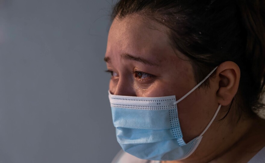 A COVID-positive woman, 25, grieves after her mother, 54, died at home of COVID-19 in September 2021 in Houston. She says they had planned to be vaccinated the following week.