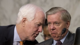 Senate Majority Whip Sen. John Cornyn, R-Texas., left, speaks with Sen. Lindsey Graham, R-S.C., right, during a Senate Judiciary Committee hearing on Capitol Hill in Washington, Tuesday, Oct. 3, 2017. 