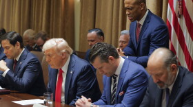 Housing and Urban Development Secretary Scott Turner prays during a Cabinet meeting with President Donald Trump at the White House in Washington on Feb. 26, 2025, as Secretary of State Marco Rubio and Defense Secretary Pete Hegseth also bows his head.
