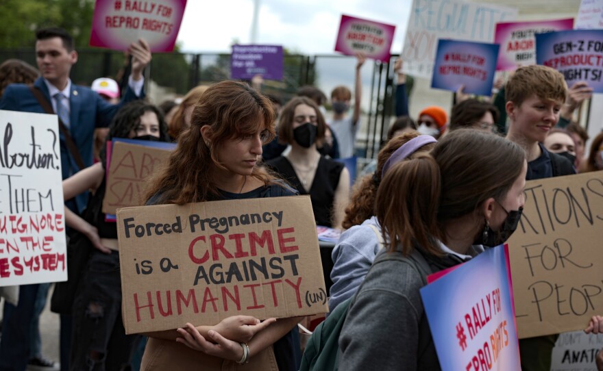 Abortion rights activists attend a rally in front of the U.S. Supreme Court Thursday in Washington.