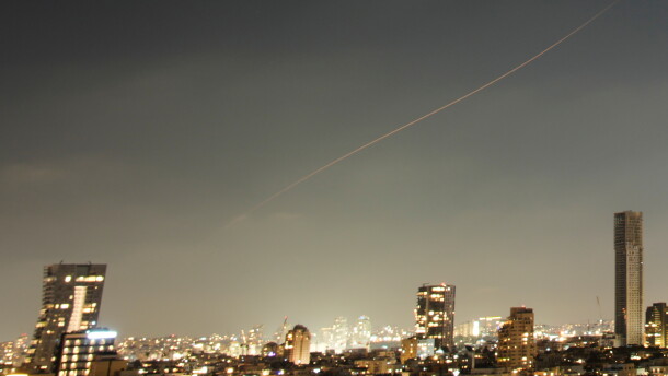 A projectile streaks through the sky over central Israel during an Iranian missile attack, Sunday, June 7, 2026.