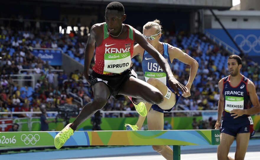 Kenya's Conseslus Kipruto leads America's Evan Jager and France's Mahiedine Mekhissi in the men's 3,000-meter steeplechase in Rio on Wednesday. Kipruto won in an Olympic record of 8:03:28. Jager finished second and Mekhissi was third. Kenya has won four gold medals in distance running in the past four days.