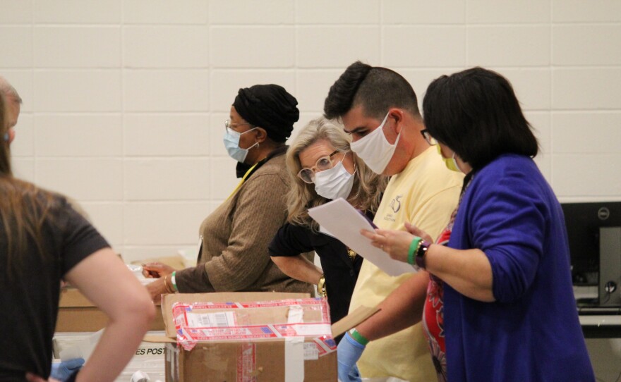 Election workers examine ballots as part of a statewide recount of the presidential race in Cobb County, Ga. on Nov. 13.