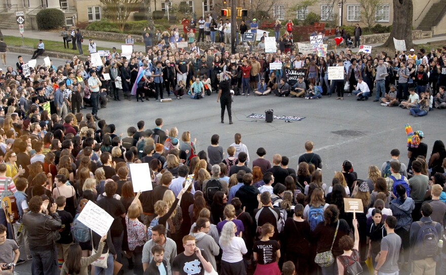 Hundreds attend a rally in Chapel Hill, N.C., on March 29 to protest the passage of House Bill 2. The state of North Carolina and the U.S. Justice Department are suing each other over the law's restriction on protections for lesbian, gay, bisexual and transgender people.