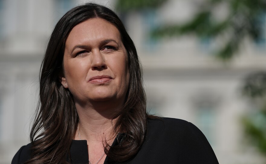 Sarah Huckabee Sanders talks to reporters outside the White House on April 29. President Trump said she would leave her job as press secretary at the end of June.