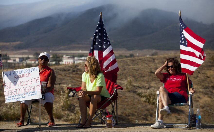 Demonstrators picket the pending arrival of undocumented immigrants who were to be processed at the Murrieta Border Patrol station.