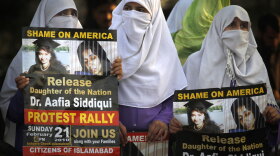 In a Feb. 21 rally in Islamabad, Pakistan, women supporters of Pakistani religious party Jamaat-e-Islami hold posters of accused al-Qaida associate Aafia Siddiqui, demanding her release. A federal court in New York convicted Siddiqui of attempted murder of U.S. troops in Afghanistan.