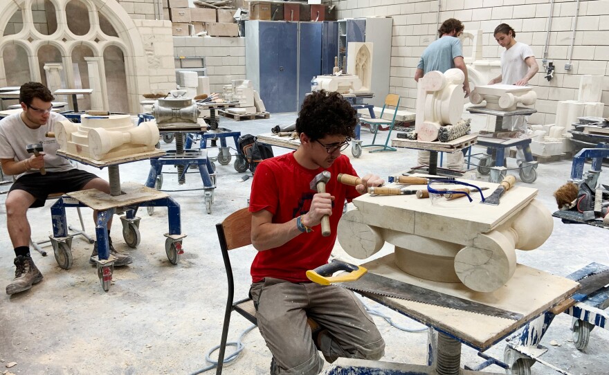 Students chip and chisel away at heavy slabs of stone in the workshops of the Hector Guimard high school, less than three miles from Paris' Notre Dame cathedral.