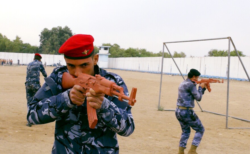 Sunni tribesmen in Iraq's western province of Anbar say Baghdad has not sent them enough weaponry or money to help in their fight against the Islamic State. Here, Sunni tribesmen take part in military training on the outskirts of Ramadi on Sunday.