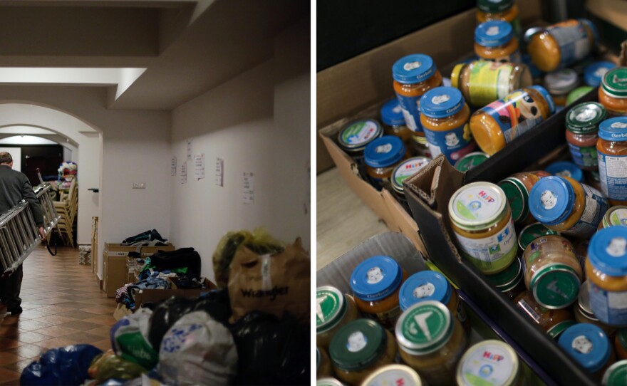 Left: A man walks with a ladder down a hallway piled with donations. Right: Donated baby food is piled in a box.