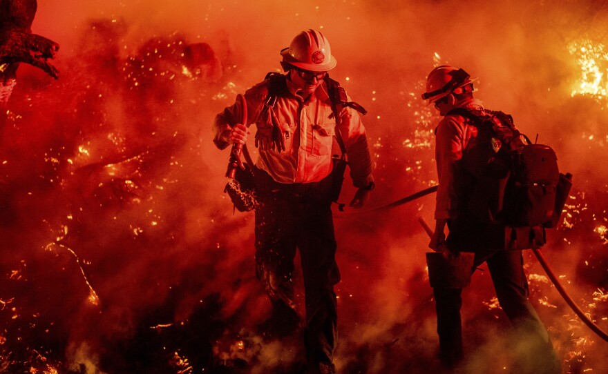 Firefighters battle the Maria Fire in California's Ventura County. The blaze has engulfed more than 8,000 acres.