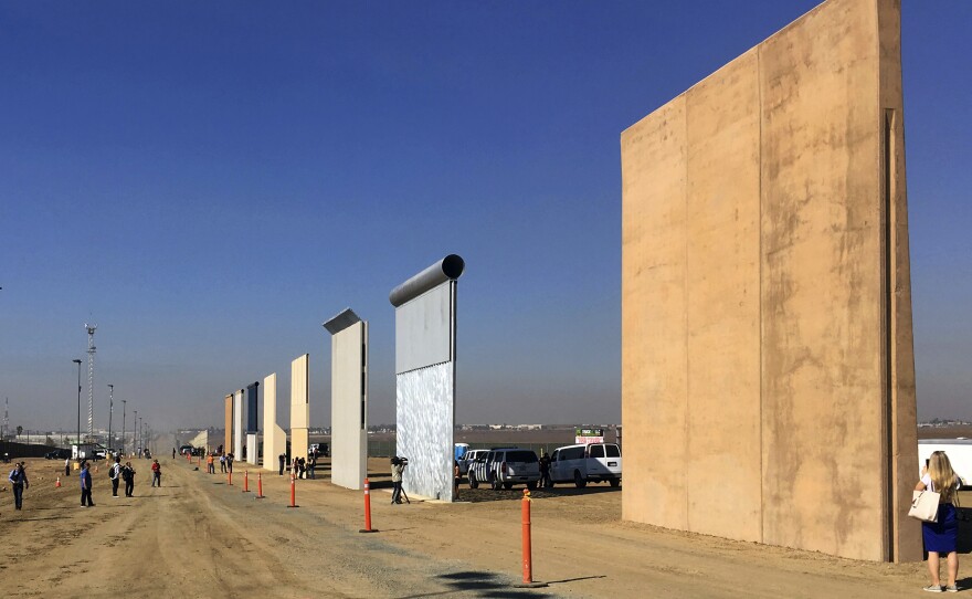 A photo from last October shows prototypes of border walls in San Diego that President Trump will be examining. He heads to California on Tuesday — his first visit to the state since becoming president.