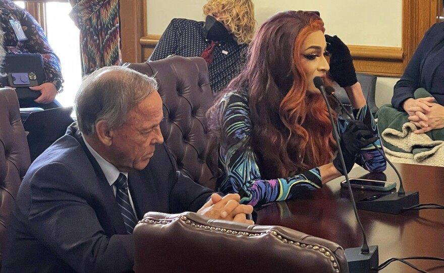 Drag performer MD Hunter, whose stage name is Athena Sinclair, testifies before an Arkansas Senate panel as Sen. Gary Stubblefield listens on Jan. 19.