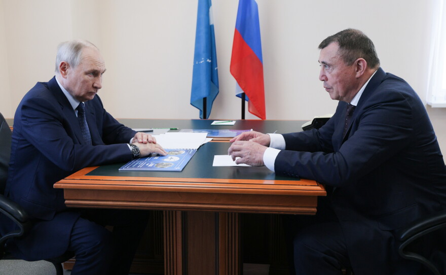 Russian President Vladimir Putin, left, listens to Sakhalin Region Governor Valery Limarenko in Kurilsk on the Iturup Island, the largest of the Kuril Islands of Russia's fareast, on Thursday, Aug. 13, 2026.