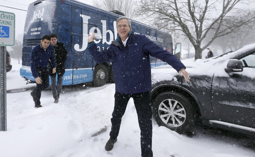 Jeb Bush throws a snowball following a campaign event Monday in Nashua, N.H.