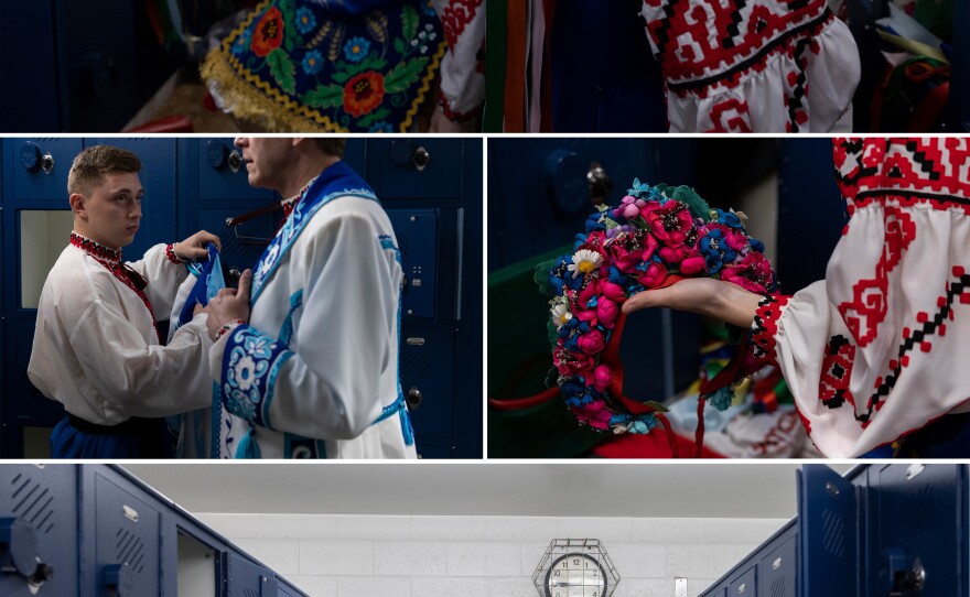 Members of the Voloshky dance ensemble get dressed and practice thier routine at the locker room at Penn High School.