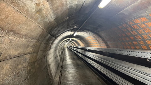 A tunnel leading from the entrance of the Sonnenberg nuclear bunker in Lucerne, Switzerland, leads to a complex deep underground. The bunker is the world's largest underground nuclear bunker, constructed to house 20,000 people.