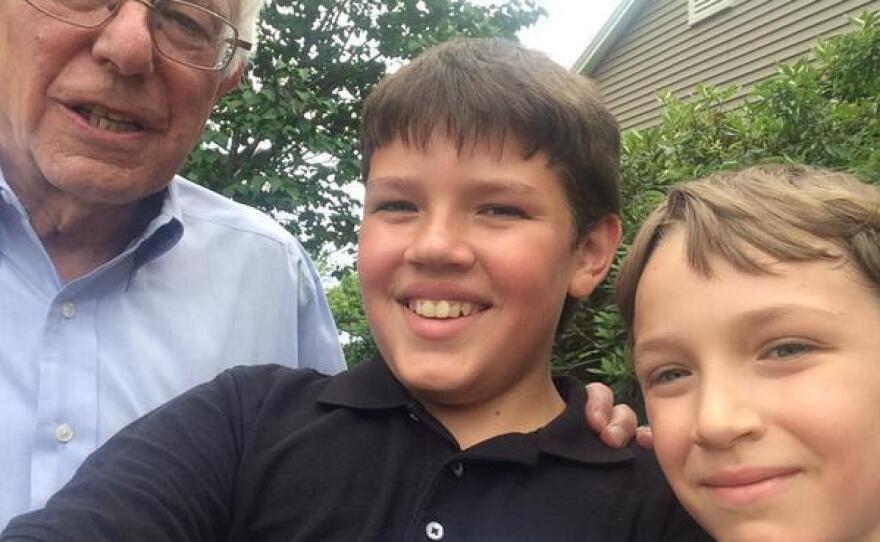 Miguel, 12, and Eduardo Figueroa, 9, posed with Bernie Sanders at a house party in Bow, N.H. Their mom, Kate Goldman, says, "We are a family of supporters of Sanders for President now!"