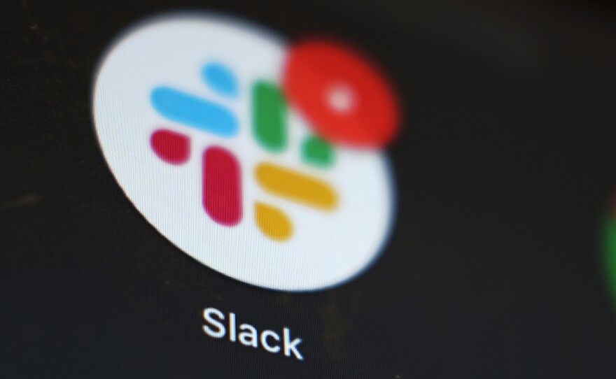 The Slack app icon is displayed on a computer screen on Dec. 2, 2020, in Tokyo. Salesforce completed a deal to buy the popular work messaging platform earlier this year.