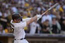 San Diego Padres' Brandon Drury watches his two-run single during the fifth inning in Game 2 of the baseball NL Championship Series between the San Diego Padres and the Philadelphia Phillies on Wednesday, Oct. 19, 2022, in San Diego.