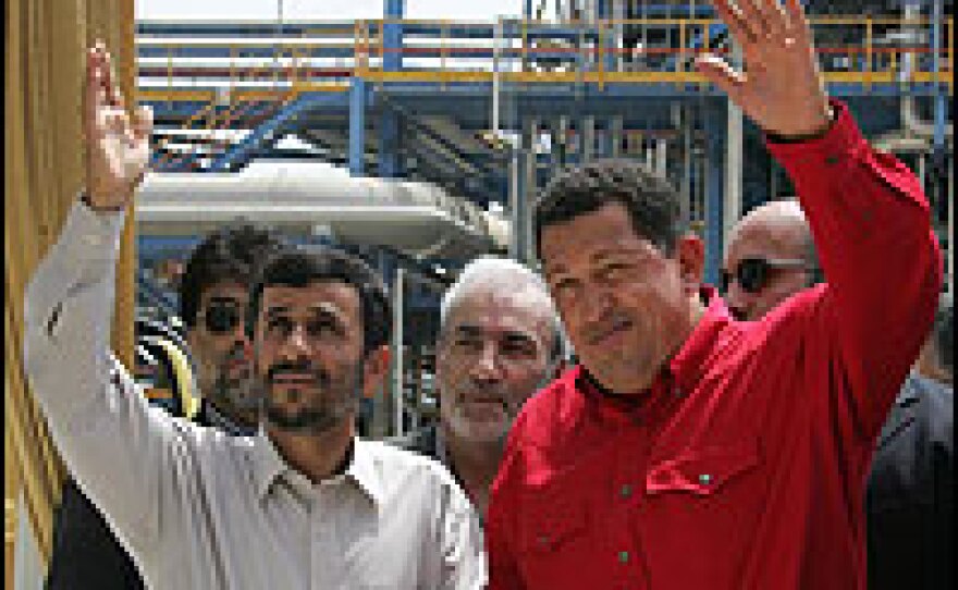 Venezuelan President Hugo Chavez (right) waves with his Iranian counterpart Mahmoud Ahmadinejad during the inauguration ceremony of a joint petrochemical plant in the Assaluyeh industrial zone on the Persian Gulf coast.