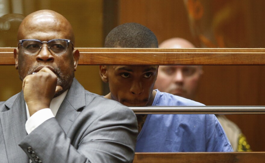 Eric Ronald Holder Jr. (right), 29, who is accused of killing of rapper Nipsey Hussle, appears for arraignment, alongside his Attorney Christopher Darden, left, on April 4, 2019 in Los Angeles.