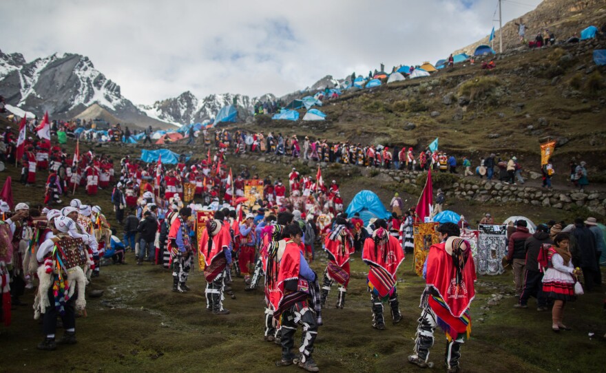 The yearly festival is called Qoyllur Riti — Snow Star in the Quechua language. Wearing traditional garb as well as special outfits made for the event, worshipers travel many miles by truck, then face a steep six-hour hike to get to the site.