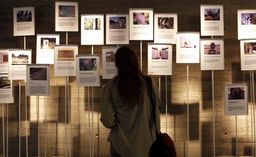 A visitor looks at a display on the opening day of the Memory and Human Rights Museum in Santiago on Jan. 11, 2010. The museum is dedicated to remembering the tens of thousands of people imprisoned, tortured or killed during the Pinochet dictatorship.