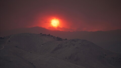 The sun sets over the Cottonwood Fire near Marysvale, Utah, on Friday, June 26, 2026.
