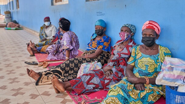People in protective masks wait in the corridor of a hospital in Bunia, Congo, Tuesday, May 19, 2026.