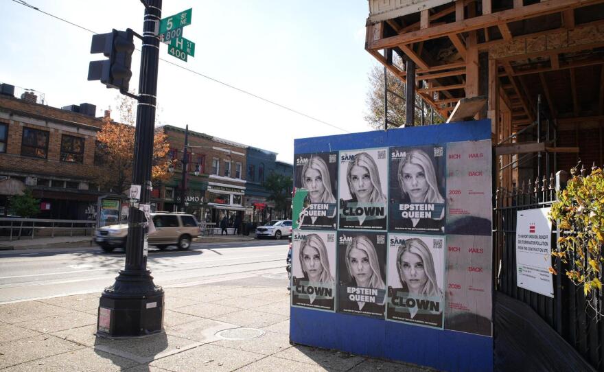 The Save America Movement, a nonprofit, has plastered posters around Washington, D.C. This one mocks Attorney General Pam Bondi for her handling of the Epstein files.