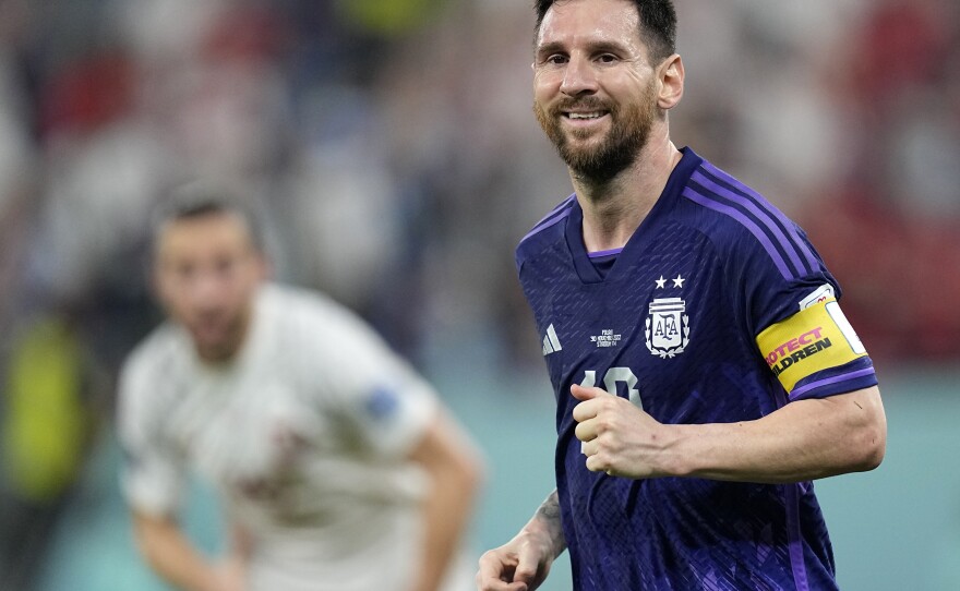 Argentina's Lionel Messi smiles during the World Cup group C soccer match between Poland and Argentina in Doha, Qatar, on Wednesday.